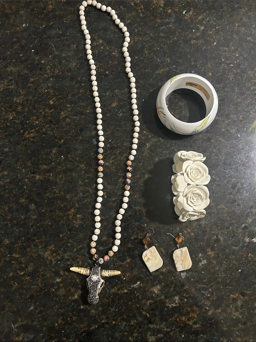 2 bracelets 1 necklace and 1 pair of earrings